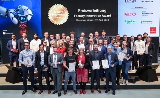 Monitor ERP employees and partners gathered at an international company event
