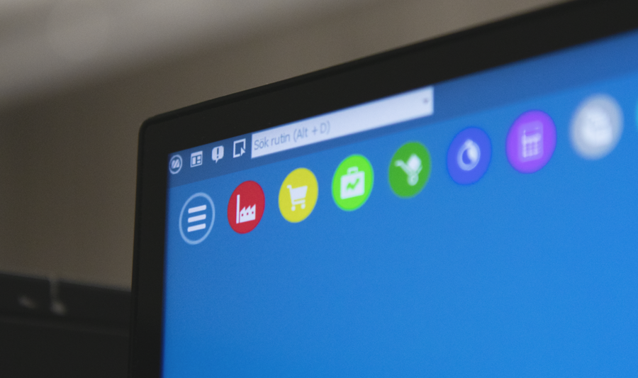 A close up of a computer screen with a blue background displaying Monitor ERP.