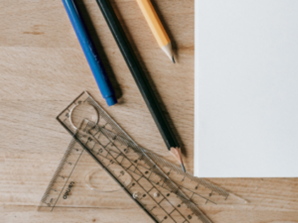 A ruler, pencils, ruler, and ruler on a table.