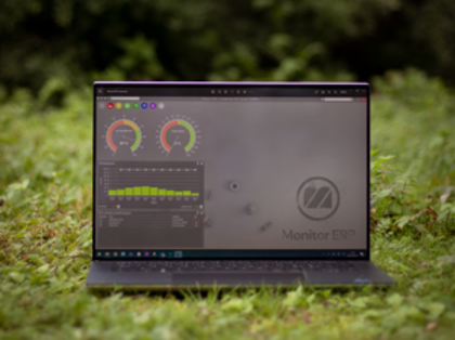 Illustration of Monitor ERP dashboards on a screen placed in nature, symbolizing sustainability.