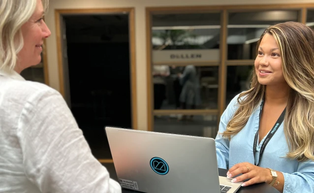 Monitor ERP employee meeting with a customer at the company's local office