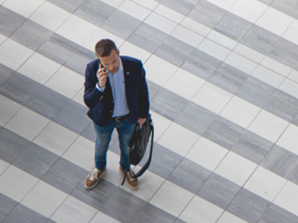 Employee using Monitor Mobile on a smartphone while away from the office