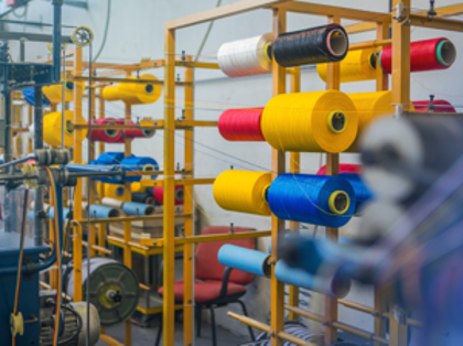 A machine room with a lot of different colored machines.